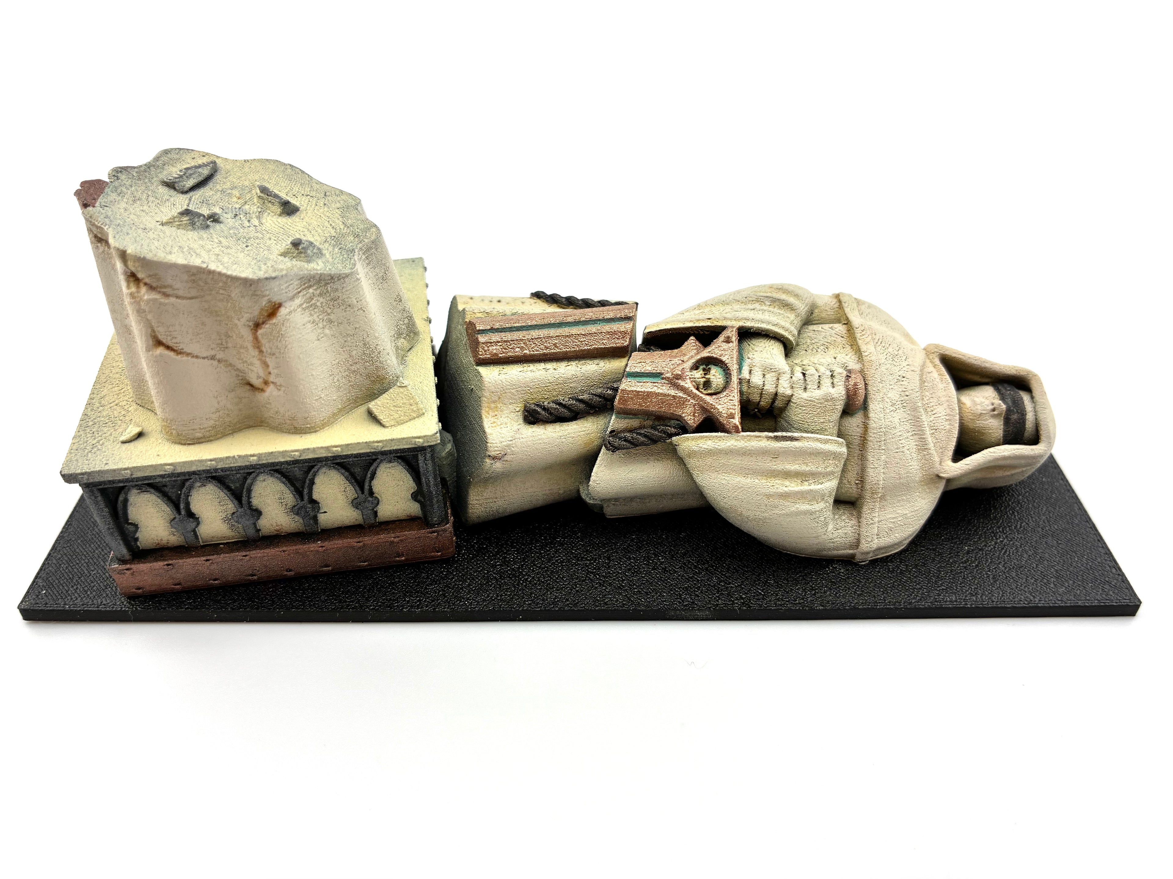 Back view of the fallen statue on the 6"x2" footprint